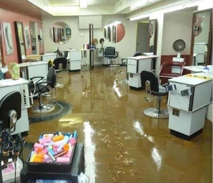 dirty, muddy floor in a salon, lots of metal equipment