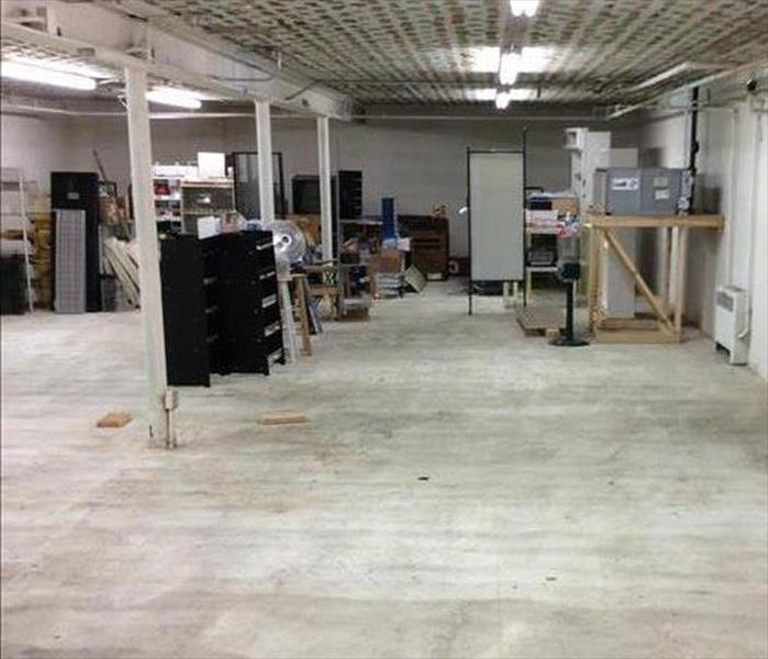 storage area with dry concrete floor, equipment and support columns