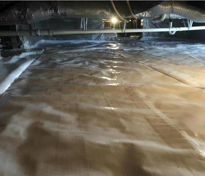 poly sheeting in a crawl space, overhead large ducts